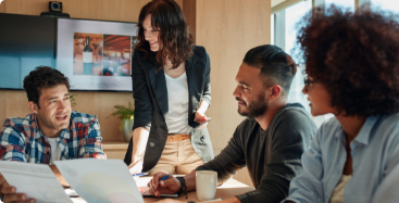 Group of professionals reviewing work documents 